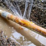 water coming out of burst pipe